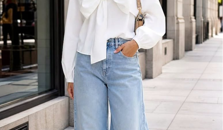 A bow statement top feels feminine, polished, and easy to wear when you balance …